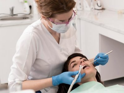 female-patient-having-procedure-done-dentist